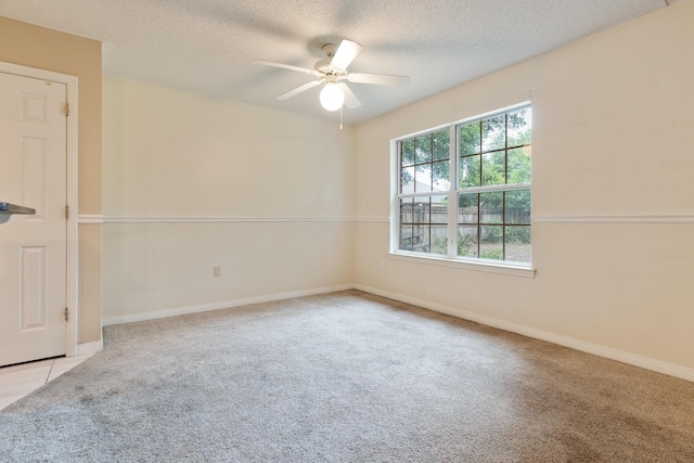 209 Warrior St, Crestview, FL 32536 - carpeted empty room with ceiling fan, a textured ceiling, and baseboards