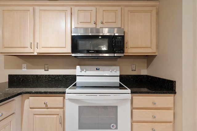 209 Warrior St, Crestview, FL 32536 - kitchen with stainless steel microwave, white range with electric stovetop, and light brown cabinets