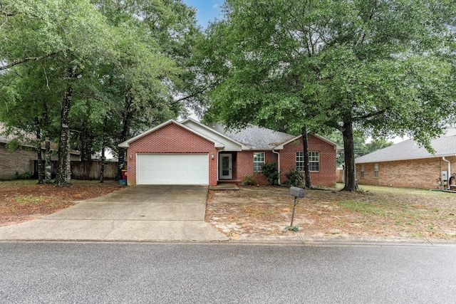 209 Warrior St, Crestview, FL 32536 - single story home with an attached garage, concrete driveway, and brick siding