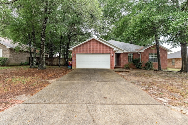 209 Warrior St, Crestview, FL 32536 - single story home featuring a garage, concrete driveway, and brick siding