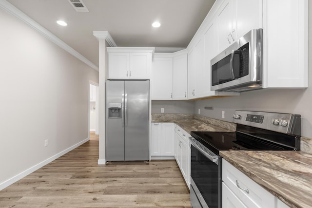 6437 Amanda Ct, Crestview, FL 32536 - kitchen featuring appliances with stainless steel finishes, crown molding, white cabinets, light stone countertops, and recessed lighting