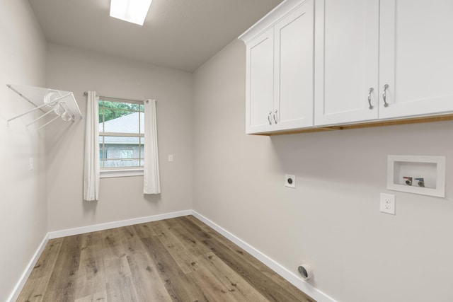 6437 Amanda Ct, Crestview, FL 32536 - washroom featuring electric dryer hookup, cabinet space, light wood finished floors, baseboards, and hookup for a washing machine