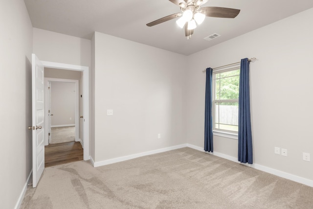 6437 Amanda Ct, Crestview, FL 32536 - unfurnished room with light carpet, a ceiling fan, and baseboards