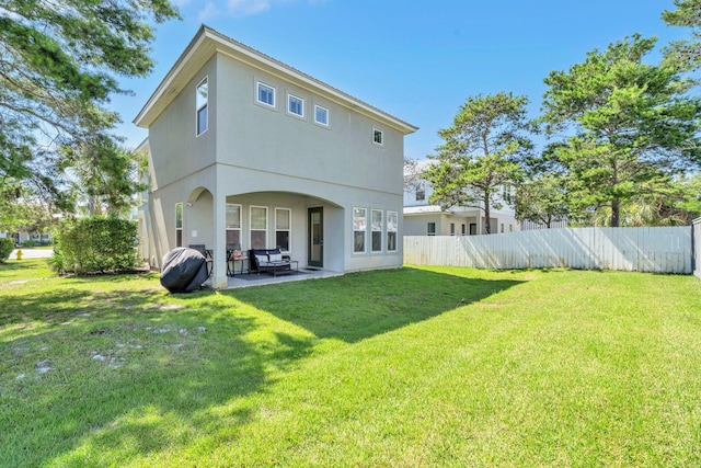 151 Penelope St, Miramar Beach, FL 32550 - back of property with a patio and stucco siding