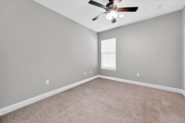 50 Oyster Blvd, Freeport, FL 32439 - unfurnished room with carpet, baseboards, ceiling fan, and a smoke detector
