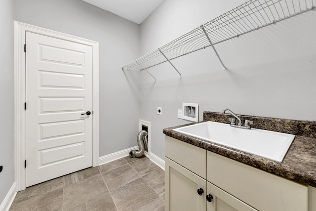 50 Oyster Blvd, Freeport, FL 32439 - laundry room featuring electric dryer hookup, cabinet space, washer hookup, and baseboards