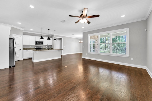 50 Oyster Blvd, Freeport, FL 32439 - unfurnished living room with ceiling fan, ornamental molding, baseboards, dark wood-style floors, and recessed lighting