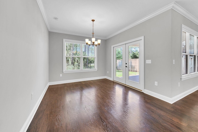50 Oyster Blvd, Freeport, FL 32439 - empty room with french doors, dark wood-style floors, a chandelier, baseboards, and ornamental molding