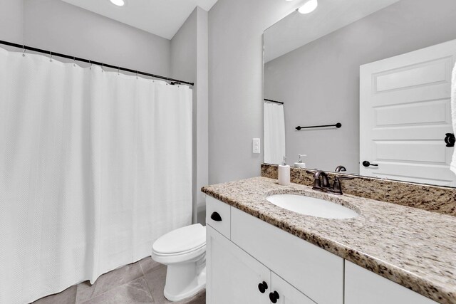50 Oyster Blvd, Freeport, FL 32439 - bathroom with vanity, toilet, tile patterned floors, a shower with curtain, and recessed lighting