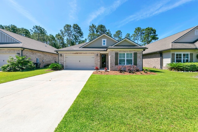 50 Oyster Blvd, Freeport, FL 32439 - view of front of property featuring a garage, concrete driveway, a front yard, and brick siding