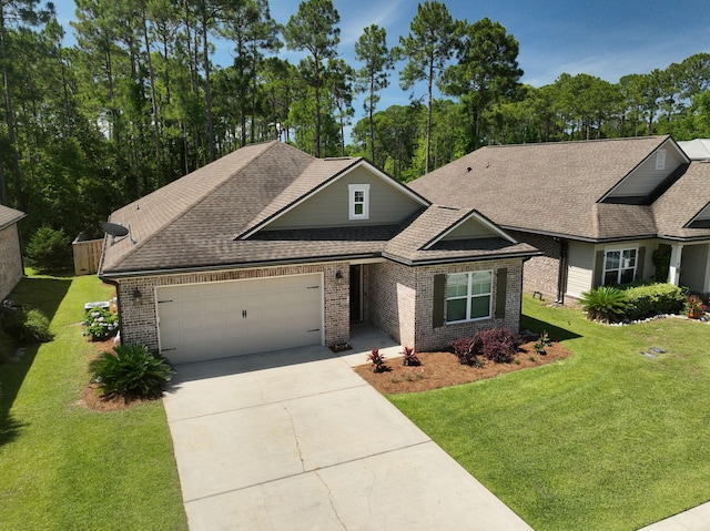 50 Oyster Blvd, Freeport, FL 32439 - view of front of property with brick siding, an attached garage, concrete driveway, and a front yard