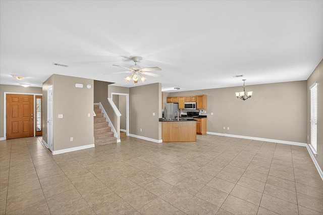 2909 Five Oaks Ln, Shalimar, FL 32579 - unfurnished living room featuring light tile patterned floors, a chandelier, and a ceiling fan