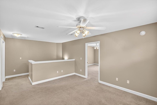 2909 Five Oaks Ln, Shalimar, FL 32579 - spare room with a ceiling fan and carpet