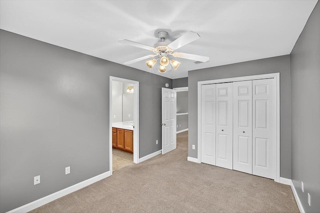 2909 Five Oaks Ln, Shalimar, FL 32579 - unfurnished bedroom featuring light colored carpet, a closet, ceiling fan, and ensuite bathroom