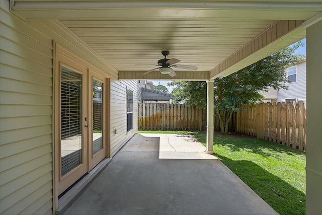 2909 Five Oaks Ln, Shalimar, FL 32579 - fenced backyard featuring ceiling fan and a patio area