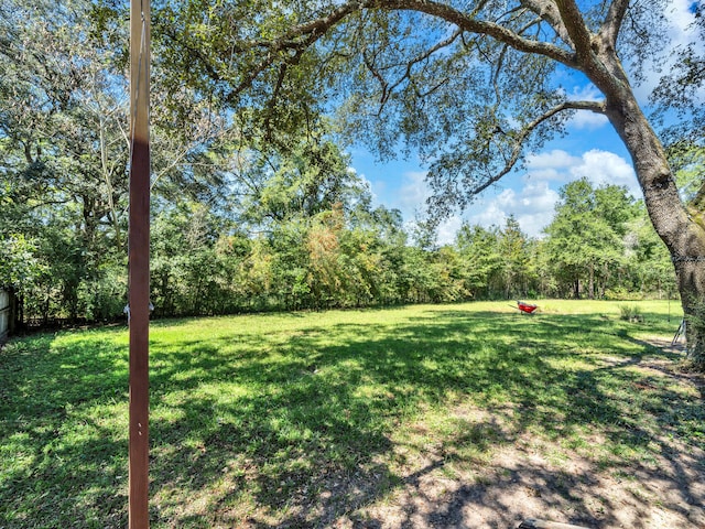 3241 Auburn Rd, Crestview, FL 32539 - view of grassy yard featuring a view of trees