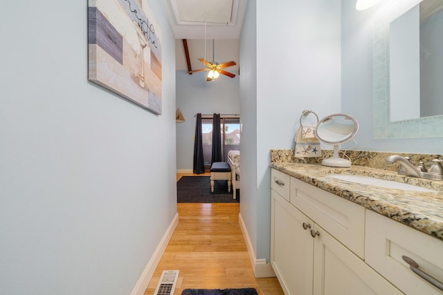 25 Misty Cv Unit 115, Miramar Beach, FL 32550 - hall with a sink, attic access, light wood-style floors, and baseboards