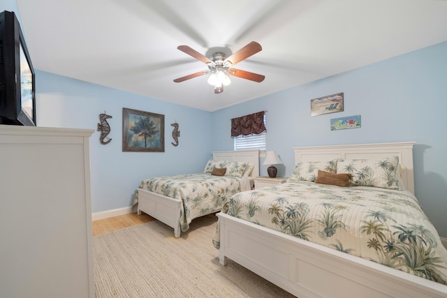 25 Misty Cv Unit 115, Miramar Beach, FL 32550 - bedroom featuring light wood-style floors, a ceiling fan, and baseboards