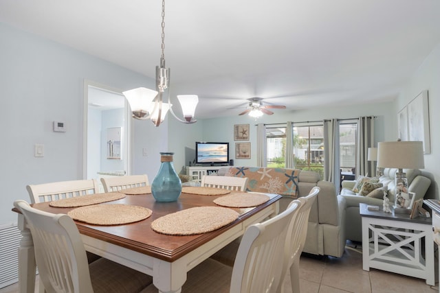 25 Misty Cv Unit 115, Miramar Beach, FL 32550 - dining room featuring light tile patterned floors, a chandelier, and a ceiling fan