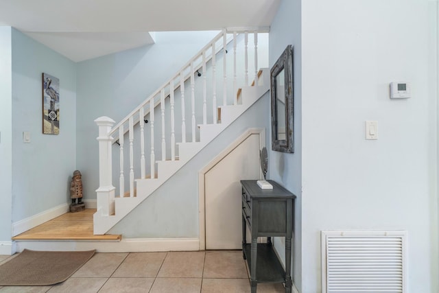 25 Misty Cv Unit 115, Miramar Beach, FL 32550 - staircase featuring tile patterned flooring and baseboards