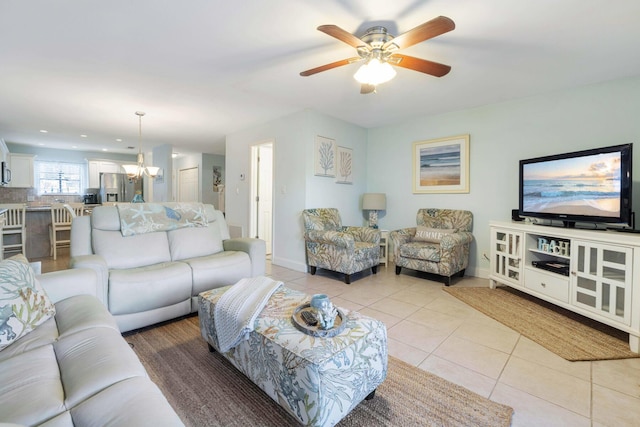 25 Misty Cv Unit 115, Miramar Beach, FL 32550 - living area with light tile patterned floors, ceiling fan, a chandelier, and baseboards