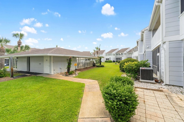 25 Misty Cv Unit 115, Miramar Beach, FL 32550 - view of grassy yard with central AC unit and a residential view