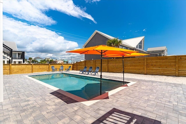 8169 White Sands Blvd, Navarre, FL 32566 - view of swimming pool with a patio area and a fenced backyard