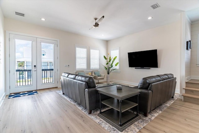 8169 White Sands Blvd, Navarre, FL 32566 - living area with french doors, wood finished floors, baseboards, and recessed lighting