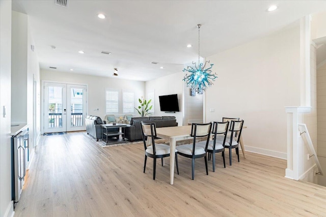 8169 White Sands Blvd, Navarre, FL 32566 - dining room featuring light wood finished floors, french doors, recessed lighting, and baseboards