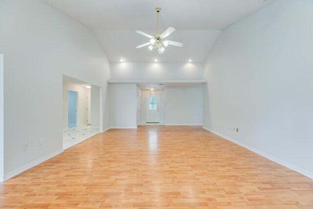 2803 Macgregor Ln, Crestview, FL 32539 - spare room with light wood-type flooring, ceiling fan, high vaulted ceiling, and baseboards