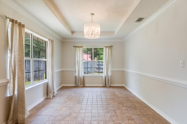 2803 Macgregor Ln, Crestview, FL 32539 - empty room with healthy amount of natural light, a chandelier, stone tile floors, and a textured ceiling