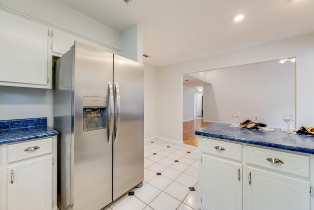 2803 Macgregor Ln, Crestview, FL 32539 - kitchen with stainless steel refrigerator with ice dispenser, white cabinets, and dark countertops