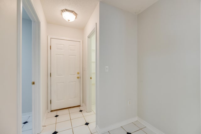 2803 Macgregor Ln, Crestview, FL 32539 - entryway featuring baseboards and light tile patterned floors