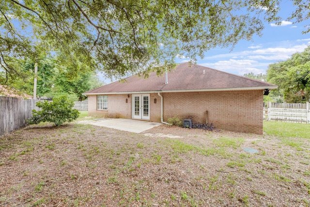 2803 Macgregor Ln, Crestview, FL 32539 - back of property featuring french doors, a patio area, a fenced backyard, and brick siding
