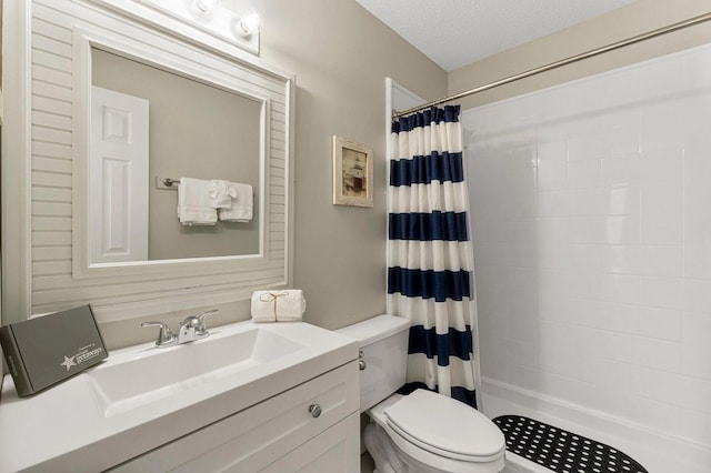 15 Cypress St Unit 268, Santa Rosa Beach, FL 32459 - full bathroom with toilet, a shower with curtain, vanity, and a textured ceiling