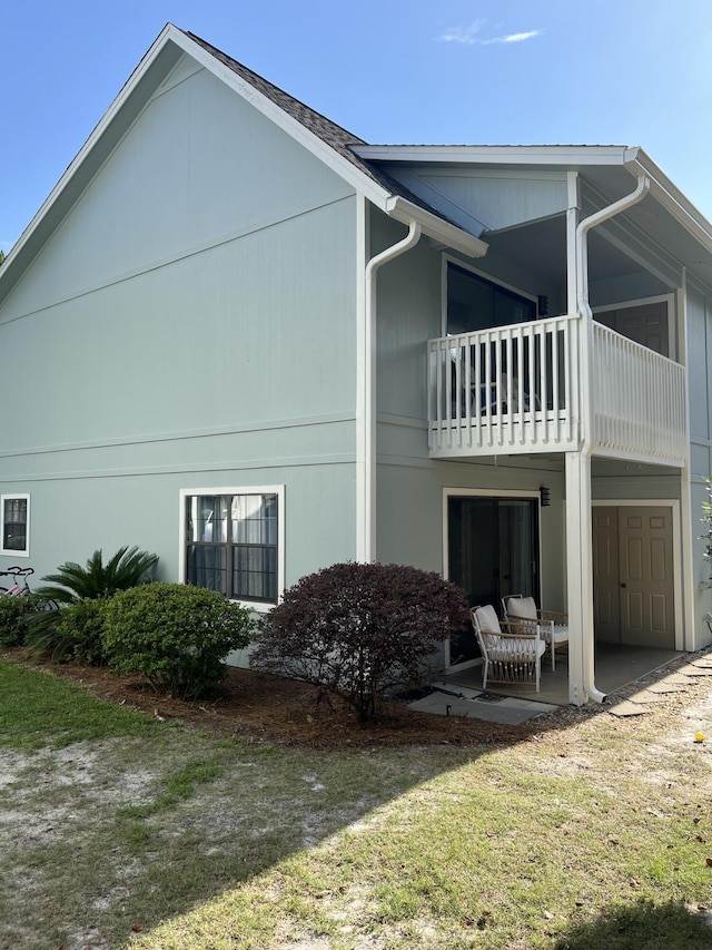 15 Cypress St Unit 268, Santa Rosa Beach, FL 32459 - view of home's exterior featuring a balcony, a patio, and a yard