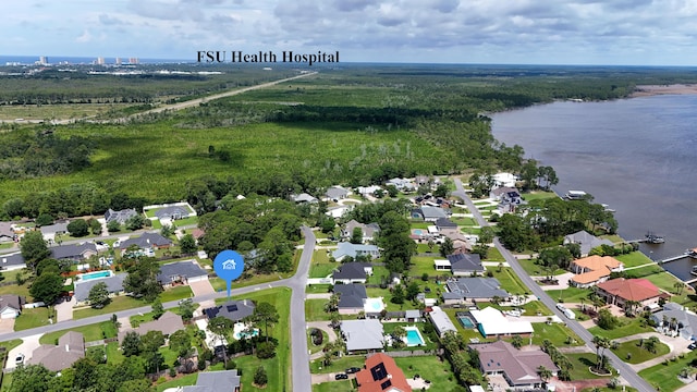 108 Colony Bay Harbour Dr, Panama City Beach, FL 32407 - aerial overview of property's location featuring a large body of water, nearby suburban area, and a forest