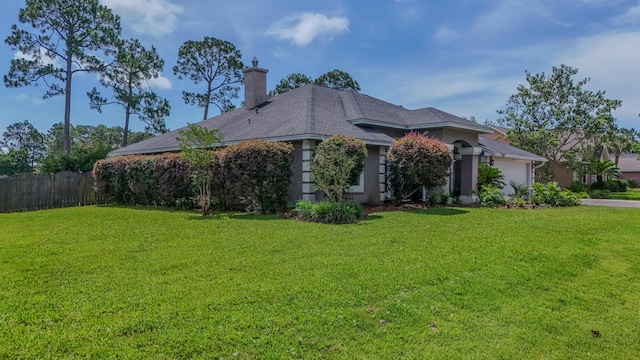 108 Colony Bay Harbour Dr, Panama City Beach, FL 32407 - view of side of home featuring an attached garage, a chimney, and driveway