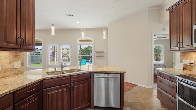 108 Colony Bay Harbour Dr, Panama City Beach, FL 32407 - kitchen with a sink, appliances with stainless steel finishes, crown molding, light stone countertops, and a textured ceiling