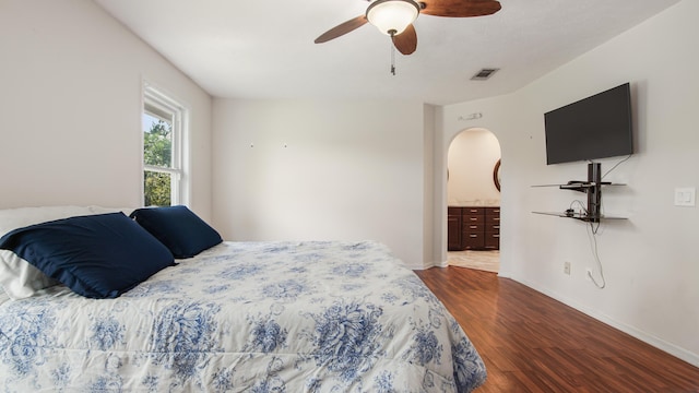 108 Colony Bay Harbour Dr, Panama City Beach, FL 32407 - bedroom with wood finished floors, baseboards, arched walkways, and ceiling fan