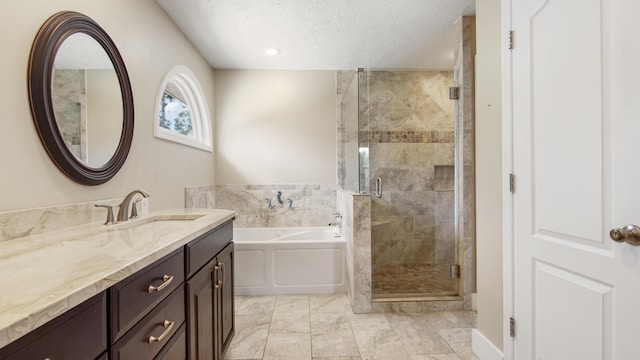 108 Colony Bay Harbour Dr, Panama City Beach, FL 32407 - bathroom with vanity, a garden tub, a textured ceiling, and a shower stall