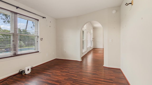 108 Colony Bay Harbour Dr, Panama City Beach, FL 32407 - unfurnished room featuring arched walkways, wood finished floors, baseboards, and a smoke detector