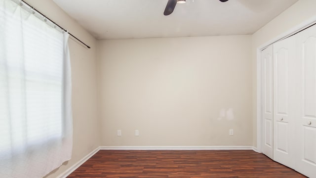 108 Colony Bay Harbour Dr, Panama City Beach, FL 32407 - unfurnished bedroom with wood finished floors, multiple windows, a closet, and baseboards