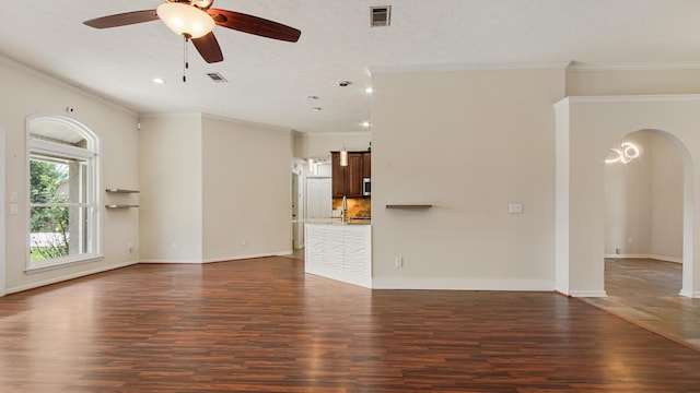 108 Colony Bay Harbour Dr, Panama City Beach, FL 32407 - unfurnished living room featuring wood finished floors, crown molding, ceiling fan, arched walkways, and recessed lighting