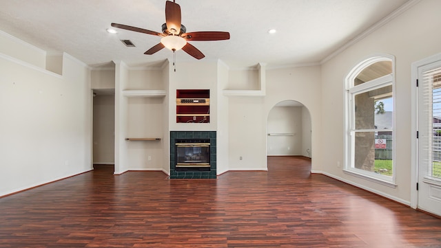 108 Colony Bay Harbour Dr, Panama City Beach, FL 32407 - unfurnished living room with wood finished floors, a ceiling fan, arched walkways, a tile fireplace, and recessed lighting