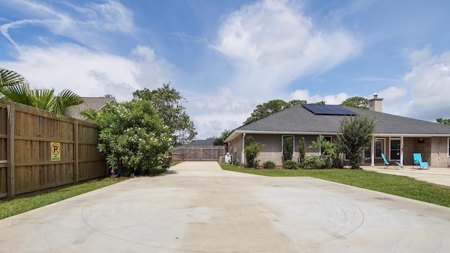 108 Colony Bay Harbour Dr, Panama City Beach, FL 32407 - view of patio with a gate and driveway