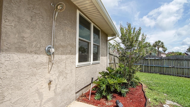 108 Colony Bay Harbour Dr, Panama City Beach, FL 32407 - view of home's exterior with stucco siding and a yard