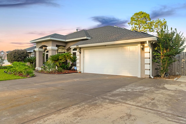 108 Colony Bay Harbour Dr, Panama City Beach, FL 32407 - view of front of property featuring concrete driveway, a garage, stucco siding, and a shingled roof