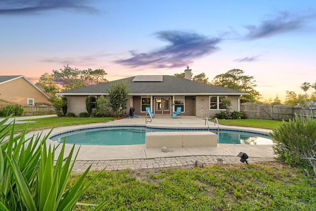 108 Colony Bay Harbour Dr, Panama City Beach, FL 32407 - pool at dusk featuring a patio area