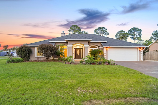 108 Colony Bay Harbour Dr, Panama City Beach, FL 32407 - view of front facade featuring concrete driveway, an attached garage, stucco siding, and roof with shingles